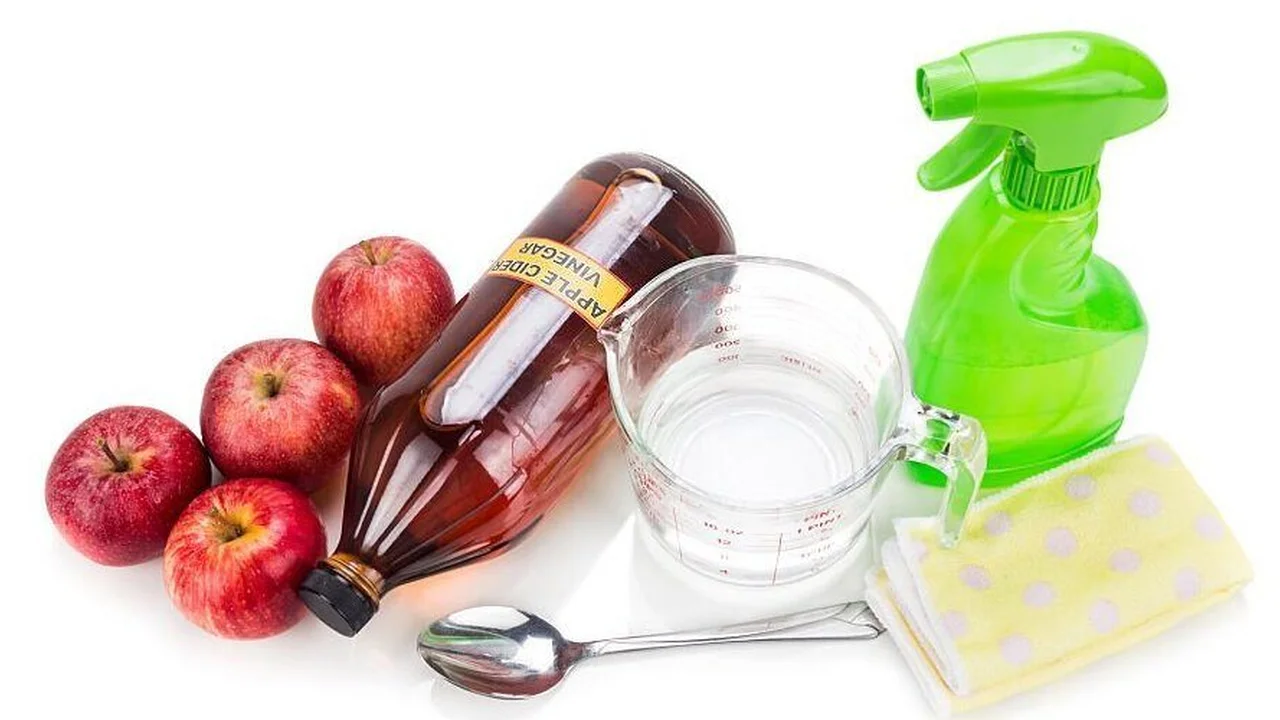 Close up on a plate of mashed potatoes, topped with baked pork chops with cream of mushroom soup, and a side of green beans.
